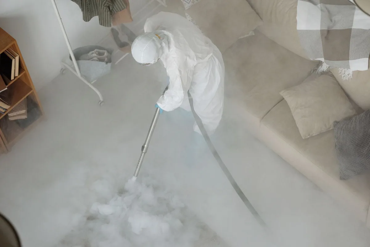 Biohazard cleanup technician in protective equipment, Waverly, NY